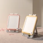 Cute antler style magnetic folding easel in pink and yellow for toddler creative drawing and playroom decor.