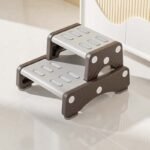 Secure rubber anti-skid base on toddler step stool for water-resistant bathroom safety.