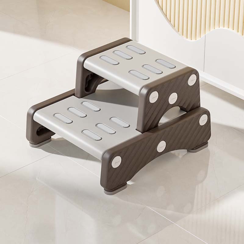 Secure rubber anti-skid base on toddler step stool for water-resistant bathroom safety.