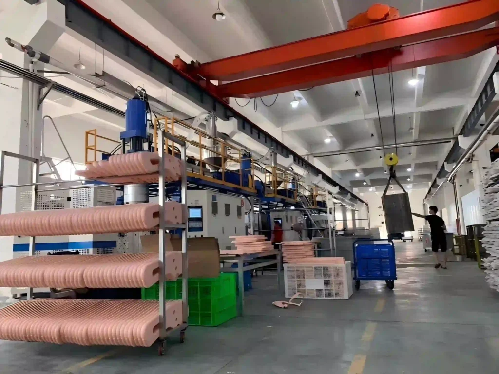 Blow molding machines and production equipment in the Inhekids workshop.