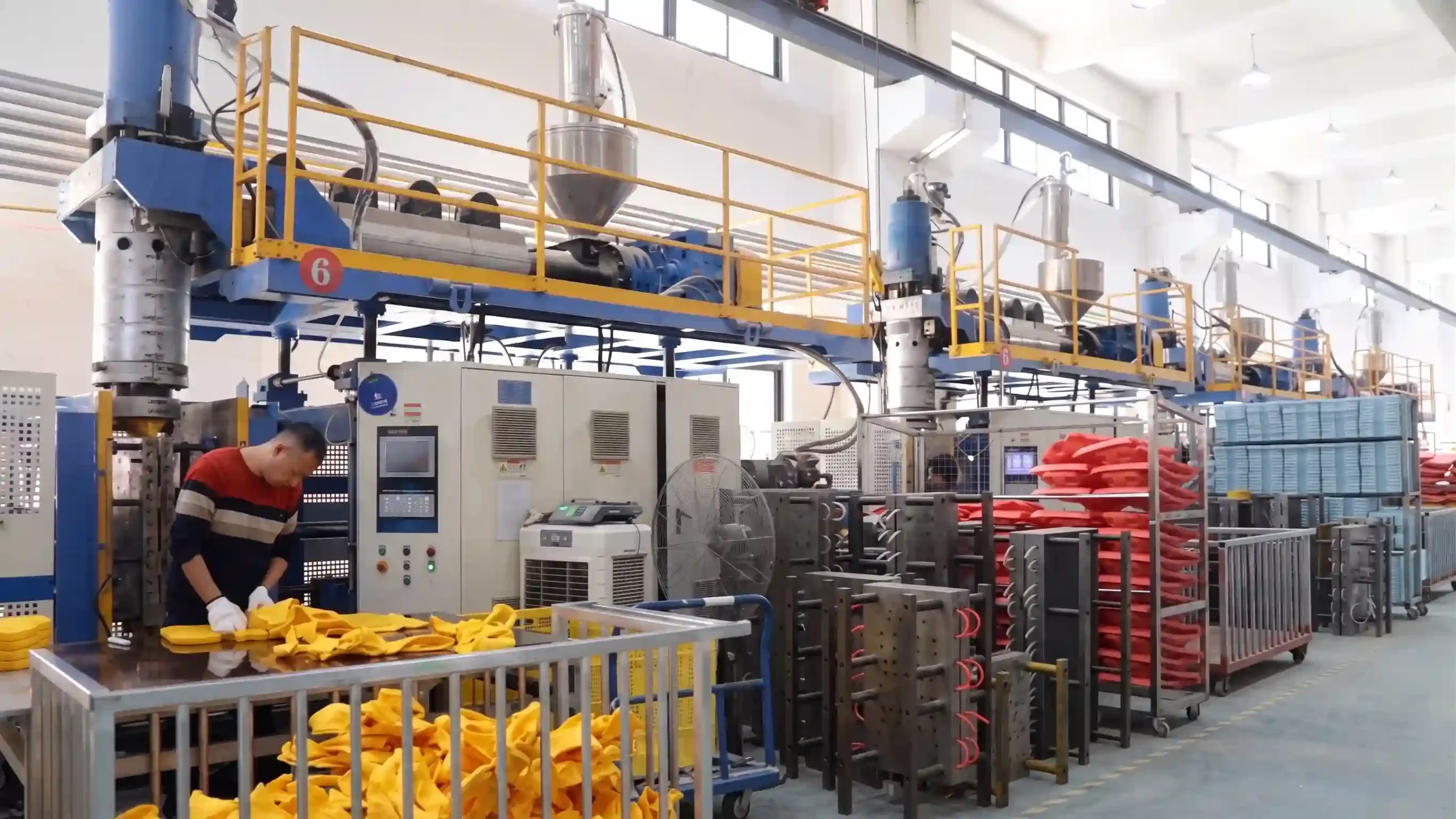 Heavy-duty industrial blow molding machinery and production lines for durable children play structures at Inhe Kids factory.