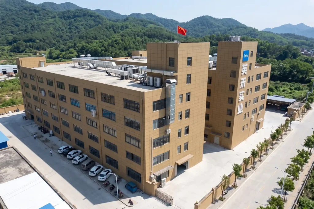 Aerial drone view of Zhejiang Inhe Industrial Co., Ltd. massive factory manufacturing facility and headquarters building in China.