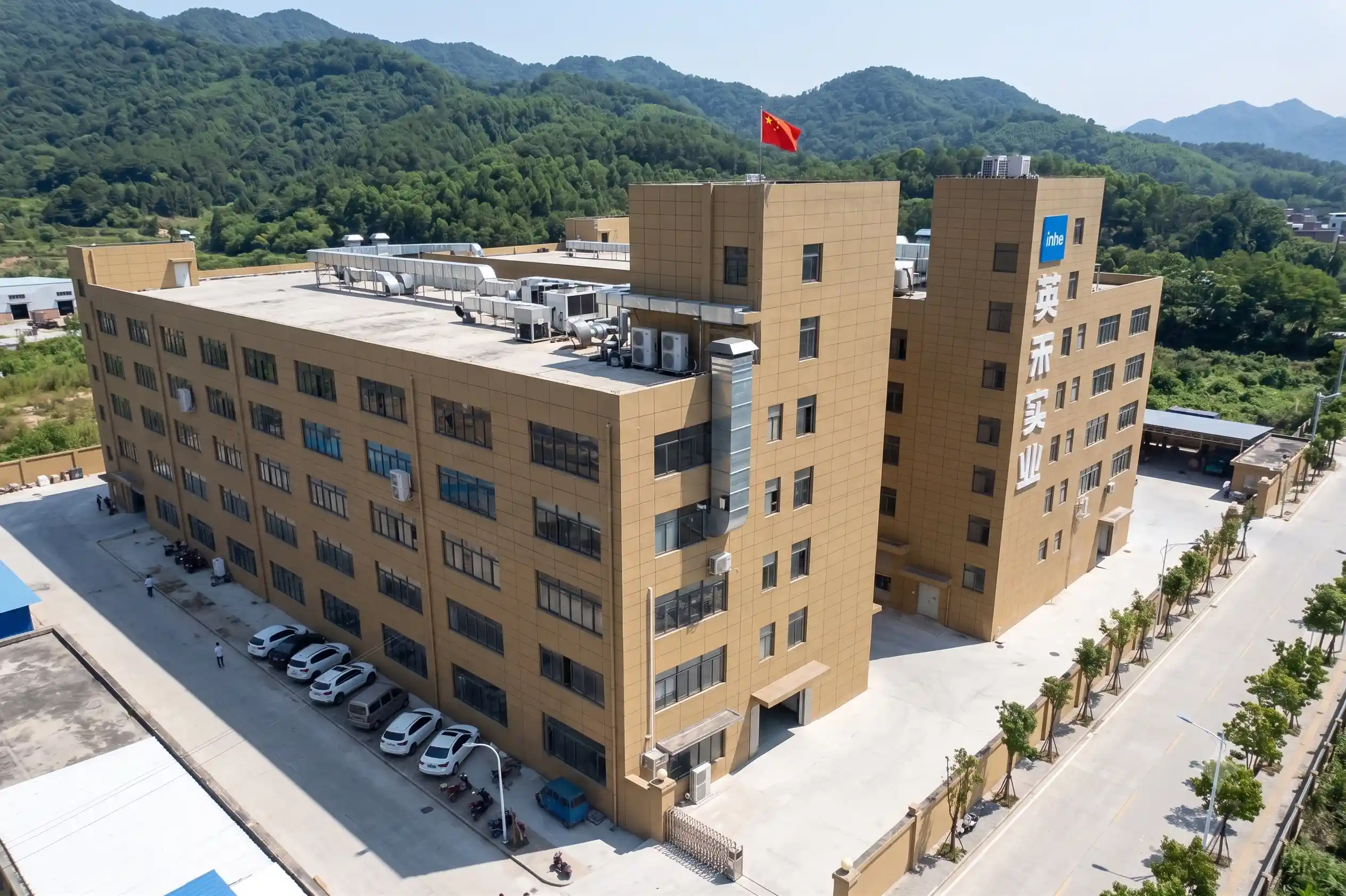 Aerial drone view of Zhejiang Inhe Industrial Co., Ltd. massive factory manufacturing facility and headquarters building in China.