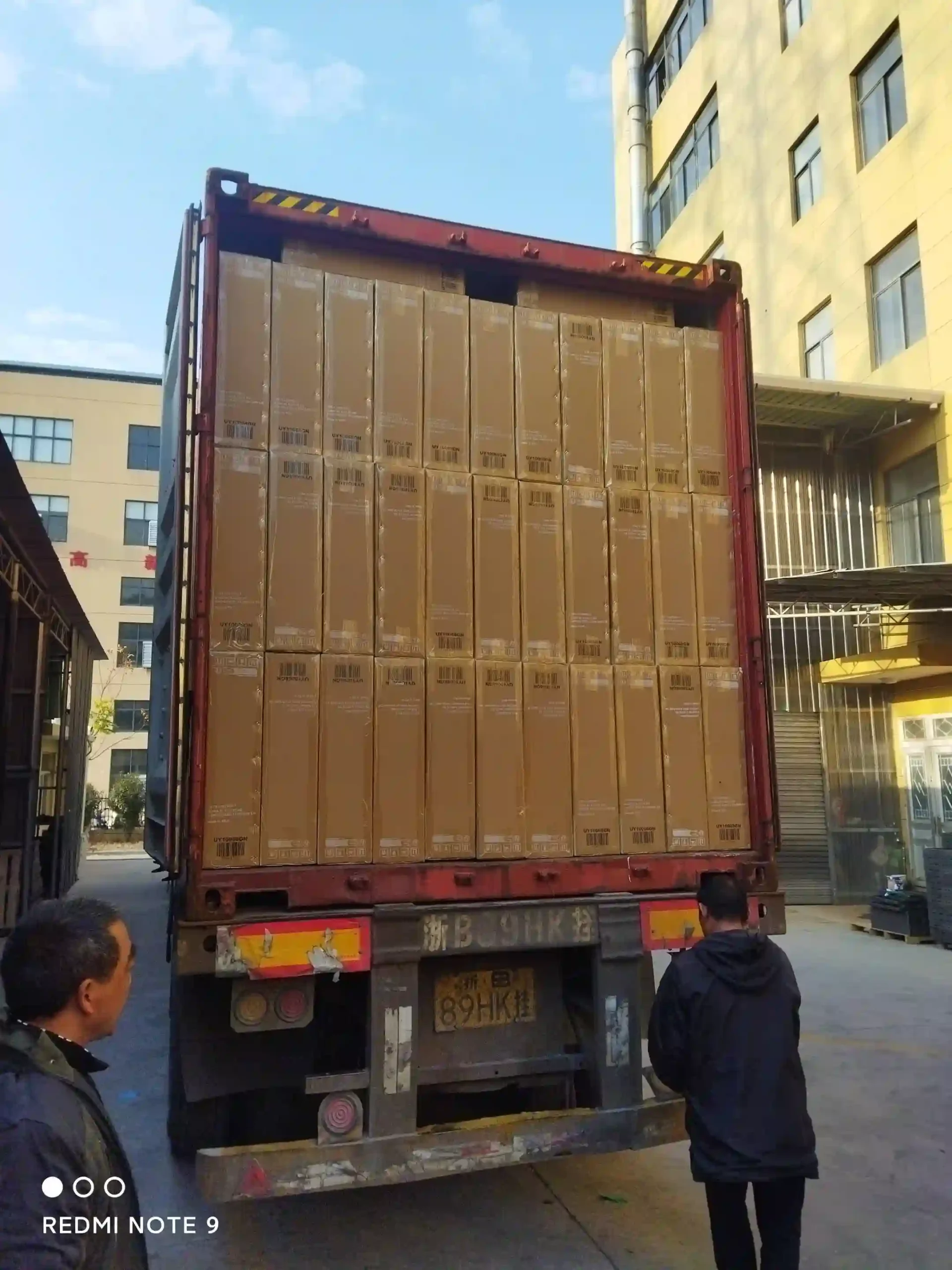 Neatly stacked export cartons fully loading a high cube shipping container at Inhekids factory
