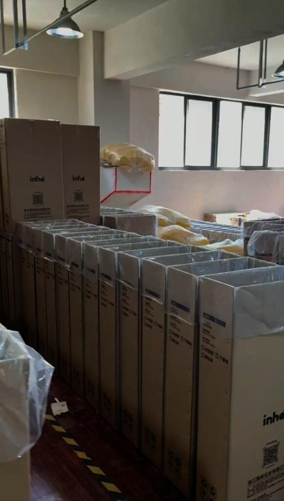 Staged export cartons containing Inhekids bookshelf products prepared for container loading