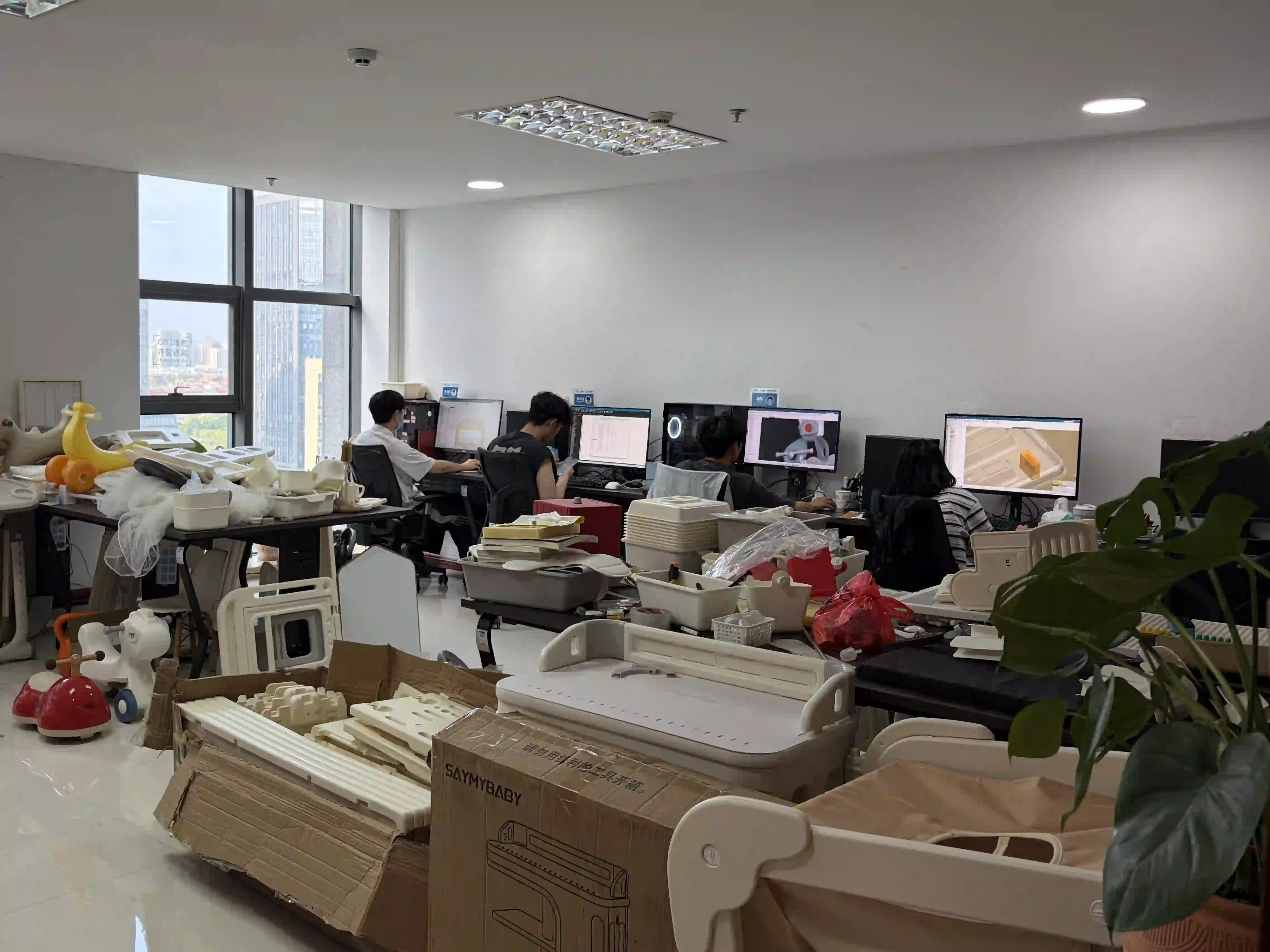 Our in-house R&D engineering team working on 3D CAD modeling, structural optimization, and physical sample testing for custom plastic kids furniture and toys.