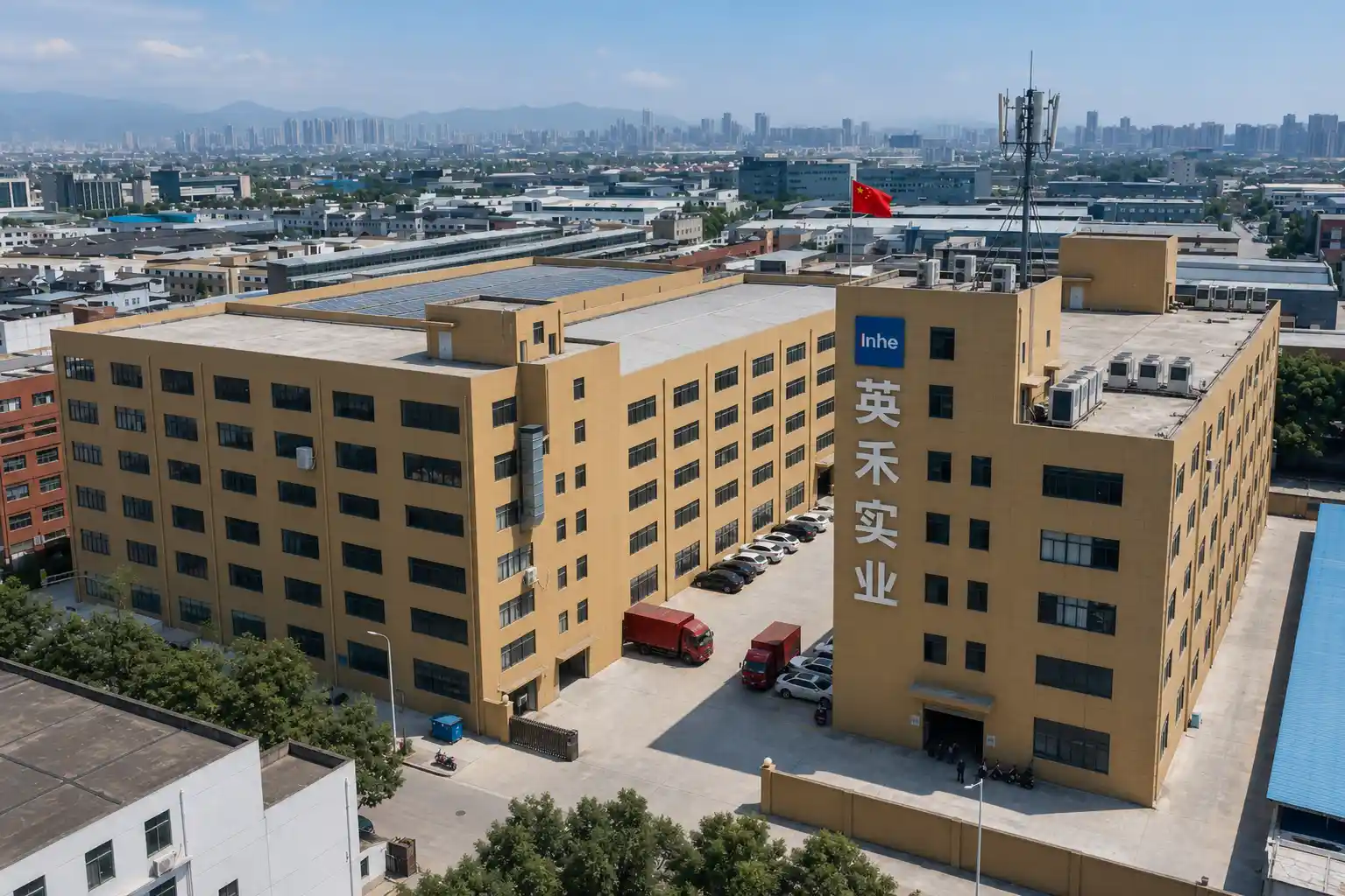 Aerial drone view of Zhejiang Inhe Industrial Co., Ltd. massive factory manufacturing facility and headquarters building in China.